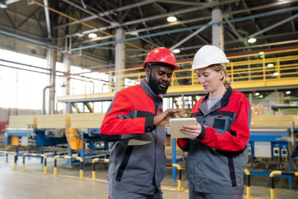 an image of manufacturing workers working with a machine learning software